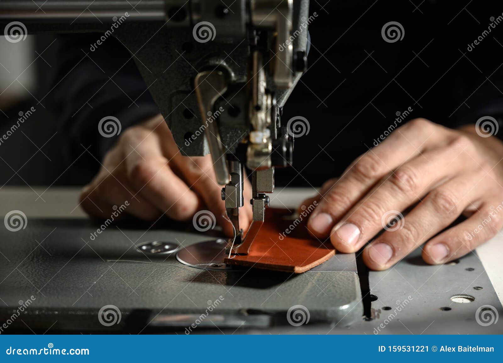 Working Process of Leather Craftsman. Tanner or Skinner Sews Leather on