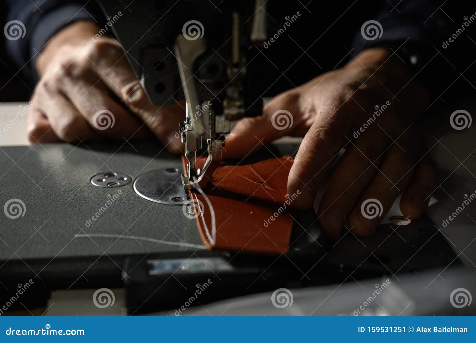 Working Process of Leather Craftsman. Tanner or Skinner Sews Leather on