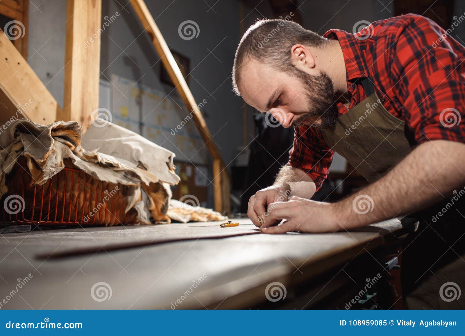 working process in the leather workshop. tanner in old tannery.