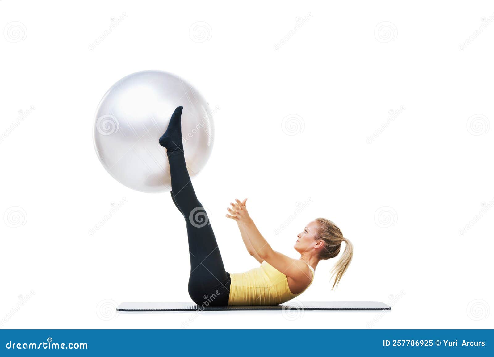Working On Toning My Stomach A Female Lifting An Exercise Ball Up With Her Legs Stock Image