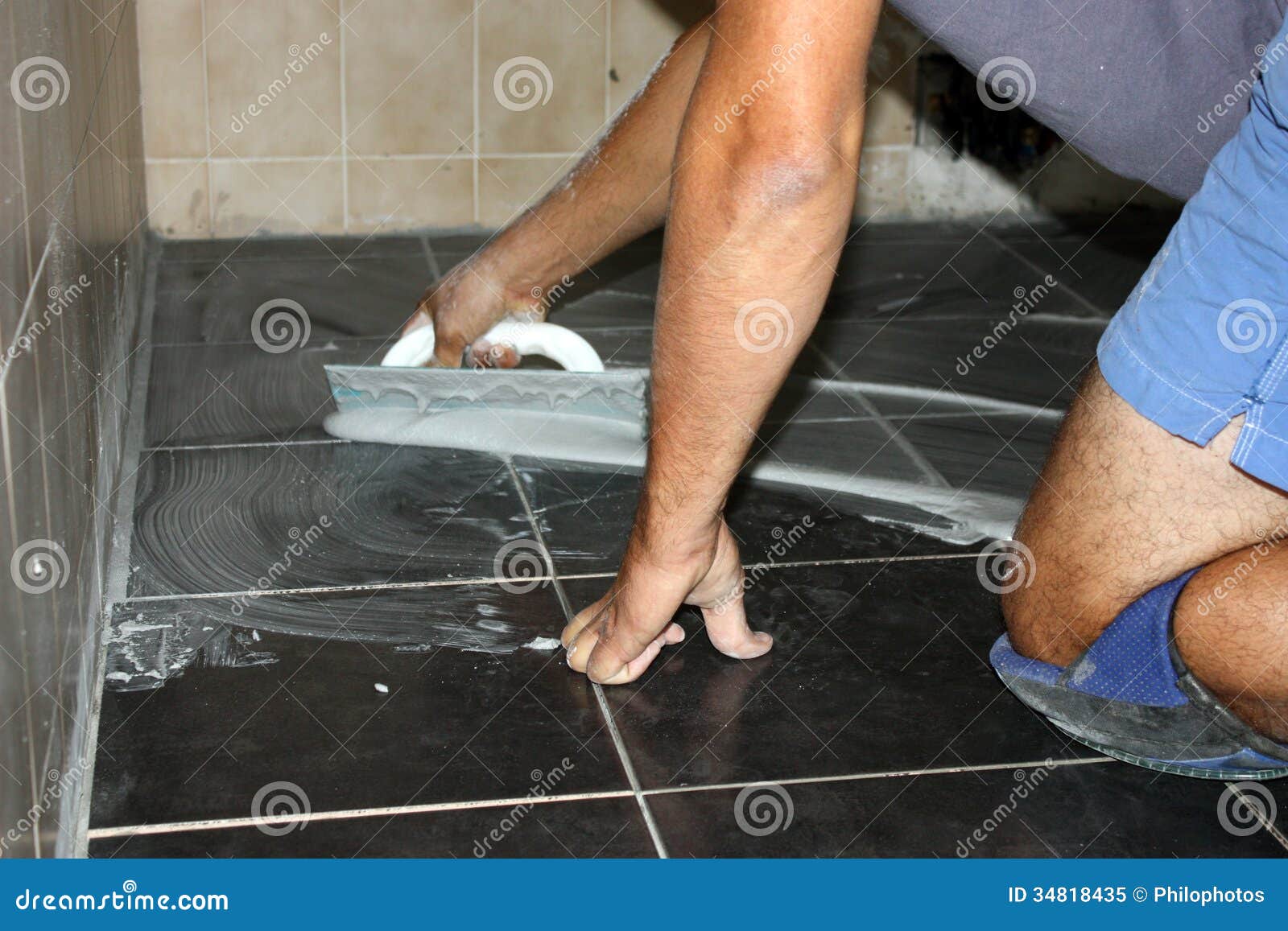 Workman on flooring stock image. Image of site, dock 34818435