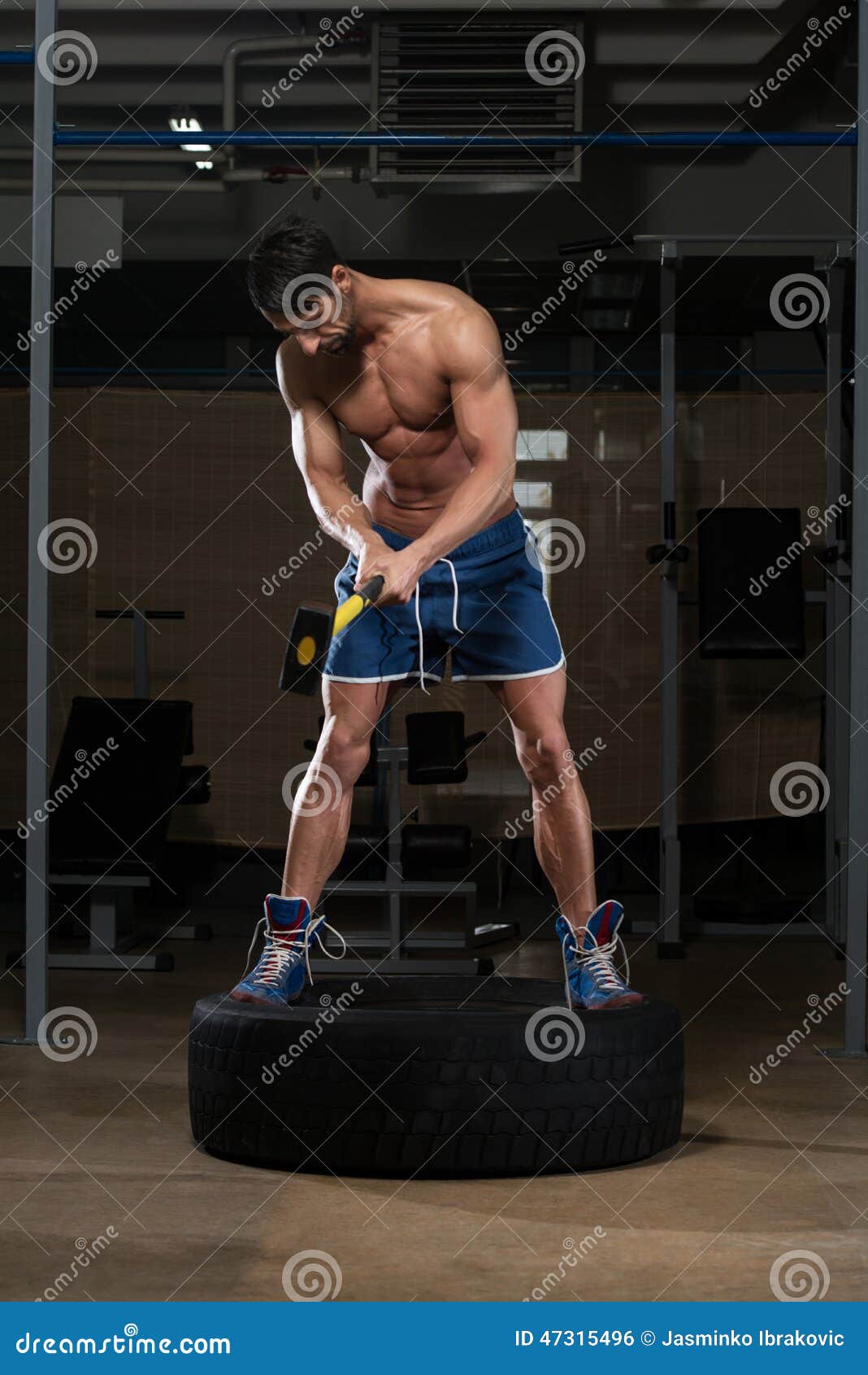 Workout at Gym with Hammer and Tractor Tire Stock Photo Image of