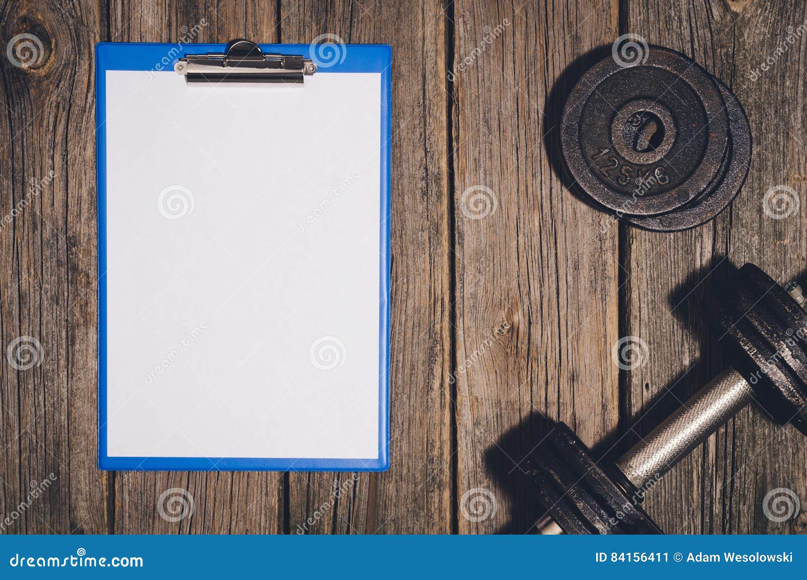 workout plan background dumbbells on wooden gym floor or workout table for gym