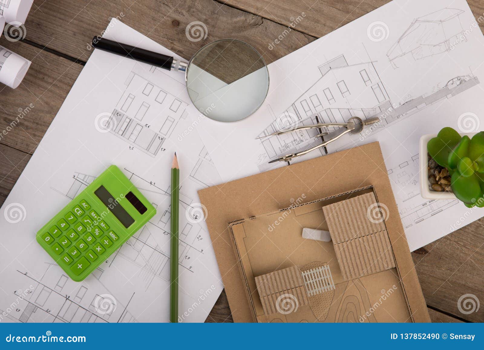 workplace-of-architect-construction-drawings-scale-model-and-tools