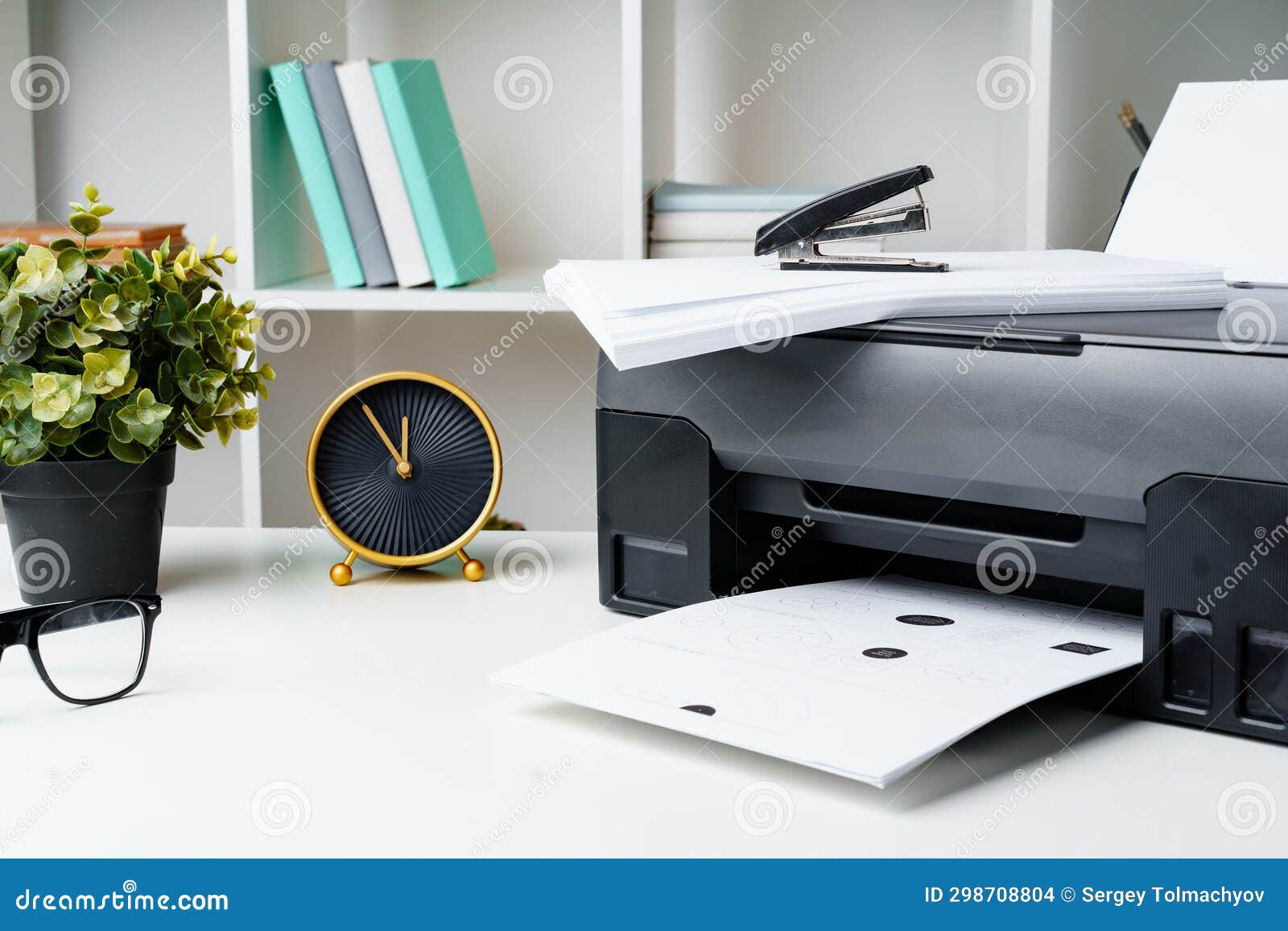 Workplace with Modern Printer and Clock in the Office Stock Photo