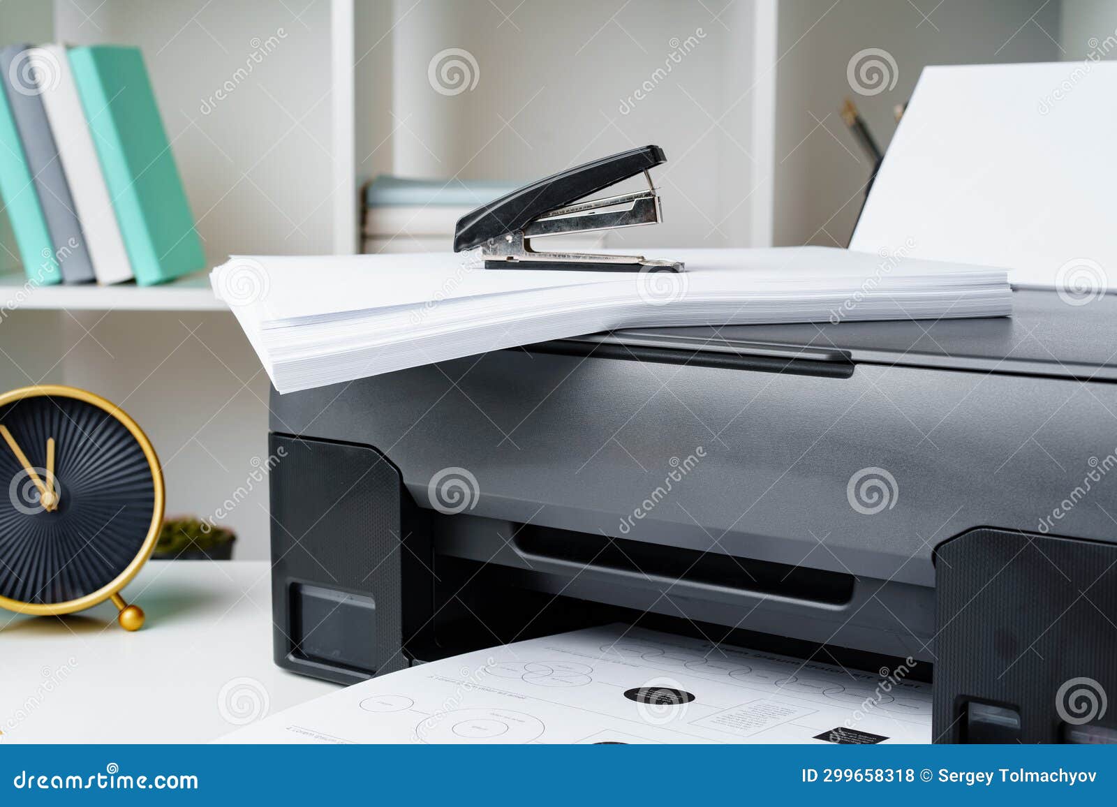 Workplace with Modern Printer and Clock in the Office Stock