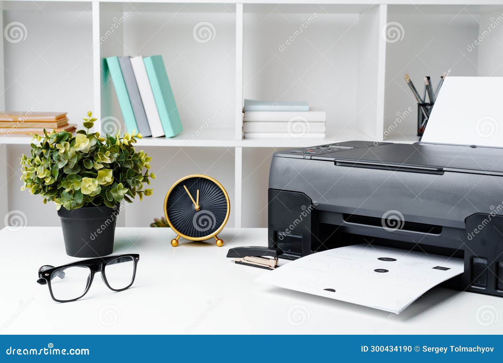 Workplace with Modern Printer and Clock in the Office Stock Photo