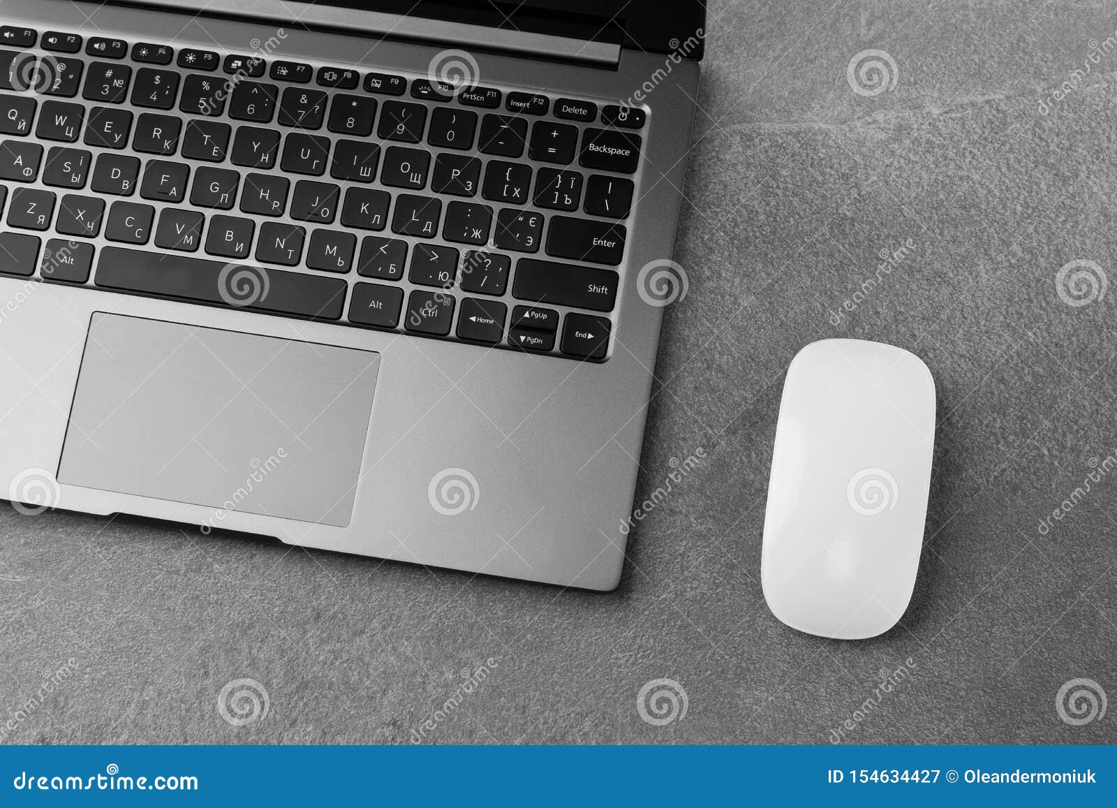 Workplace with Open Laptop with Black Screen and Mouse on Modern Grey Stone Desk, Filtered Image