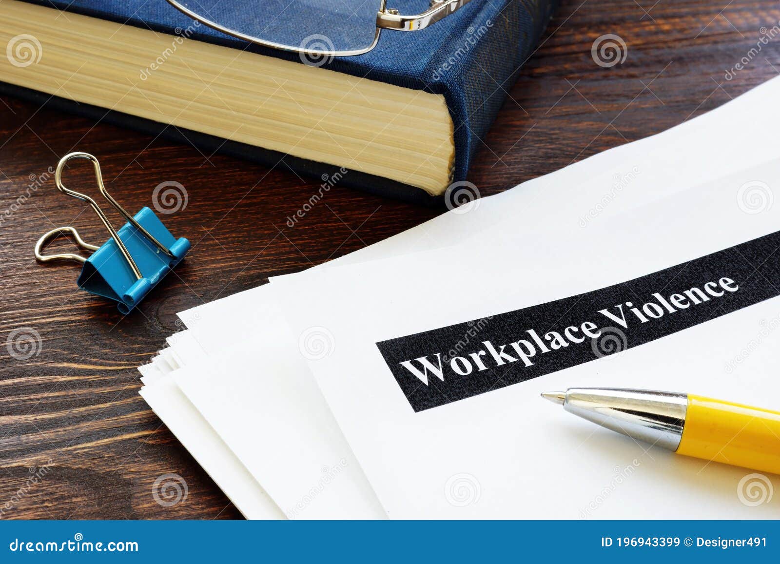 workplace violence report papers and pen.