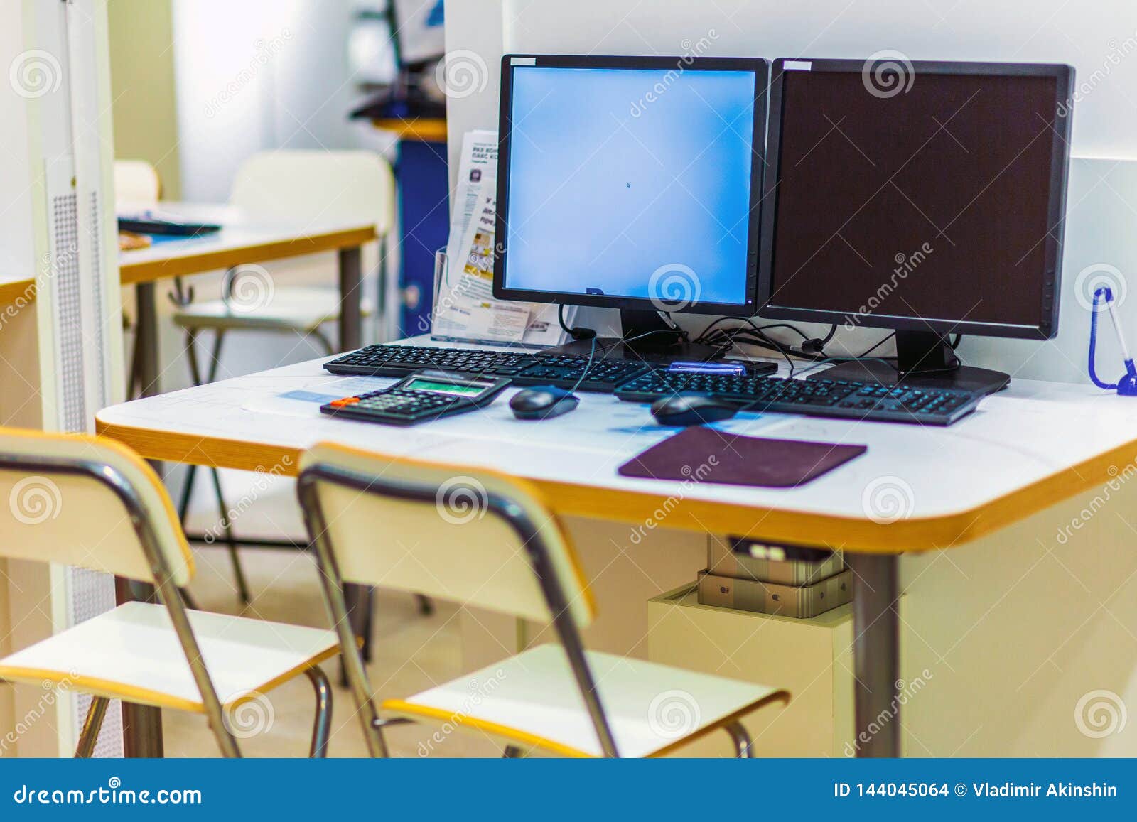 Workplaces At One Table With Two Computers In A Large Shopping