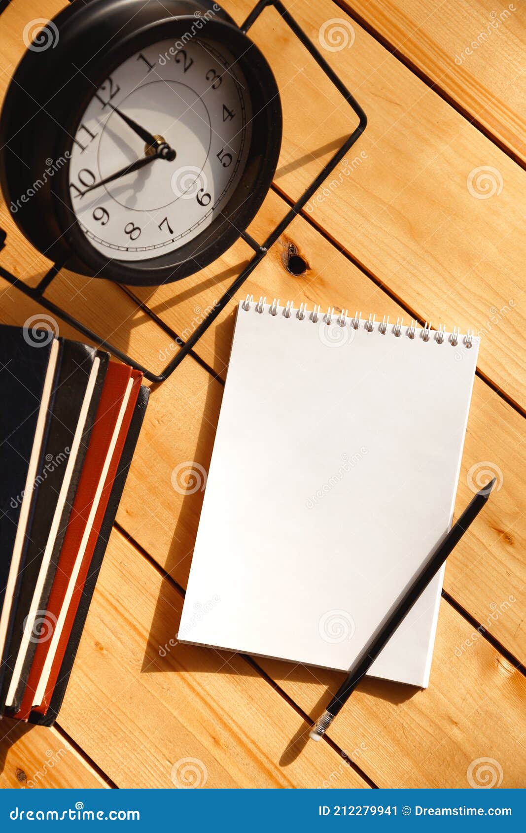 Workspace with Notepad and Desktop Clock Stock Image Image of message