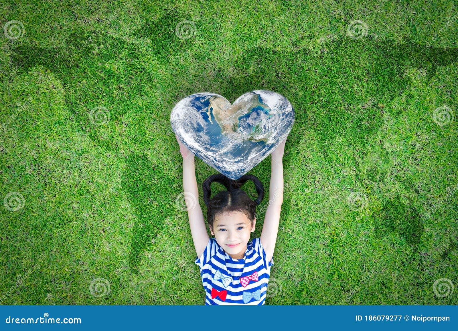 world heart day concept and well being health care campaign with smiling happy kid on eco friendly green lawn.