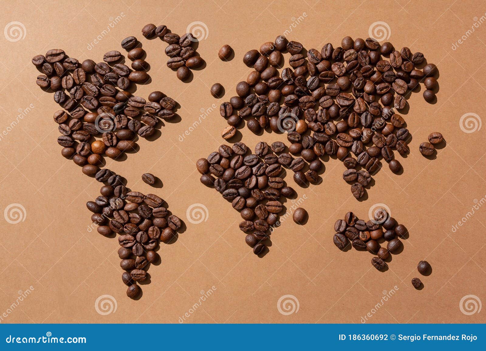 World Map Made with Coffee Beans on Brown Background Stock Photo