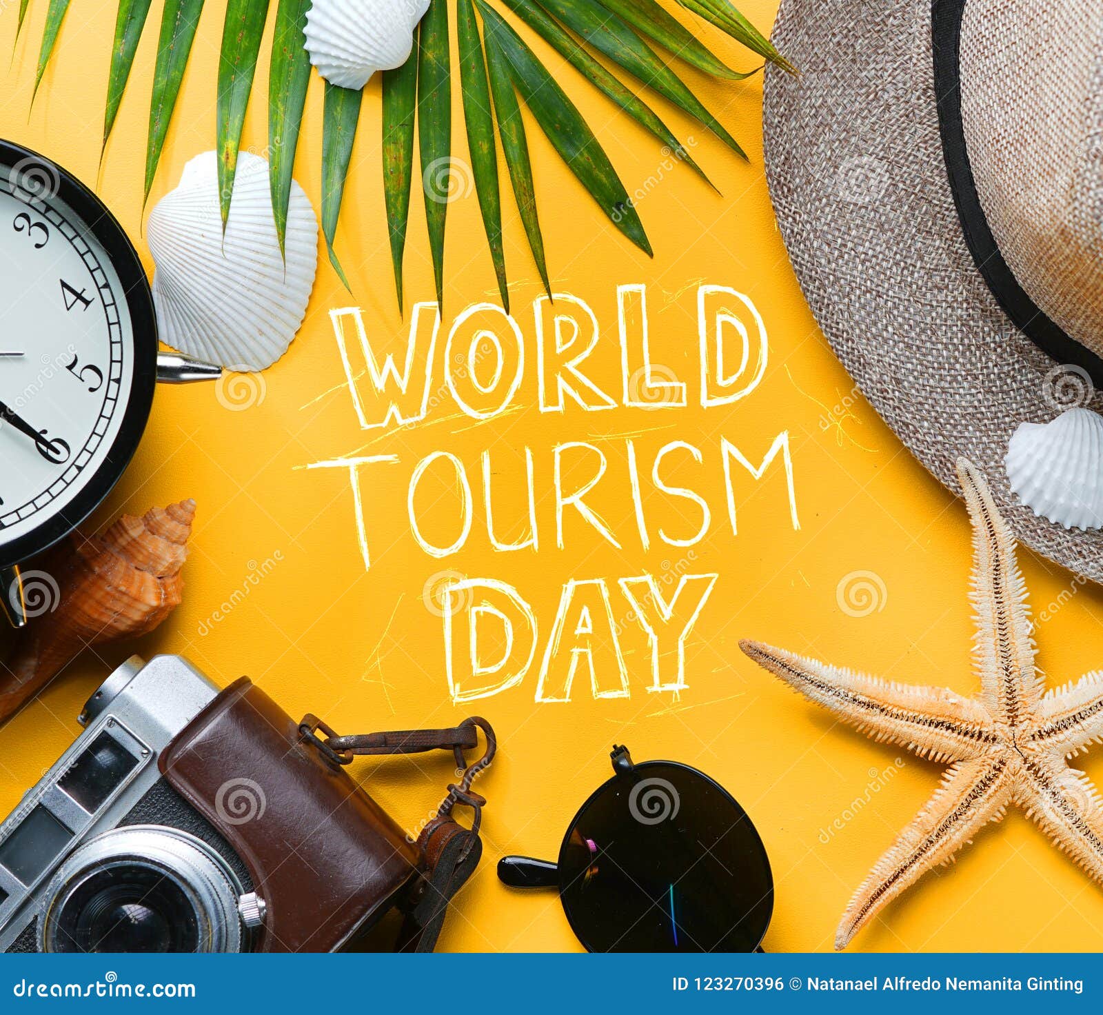 world tourism day typography. flat lay traveling holiday vacation yellow background