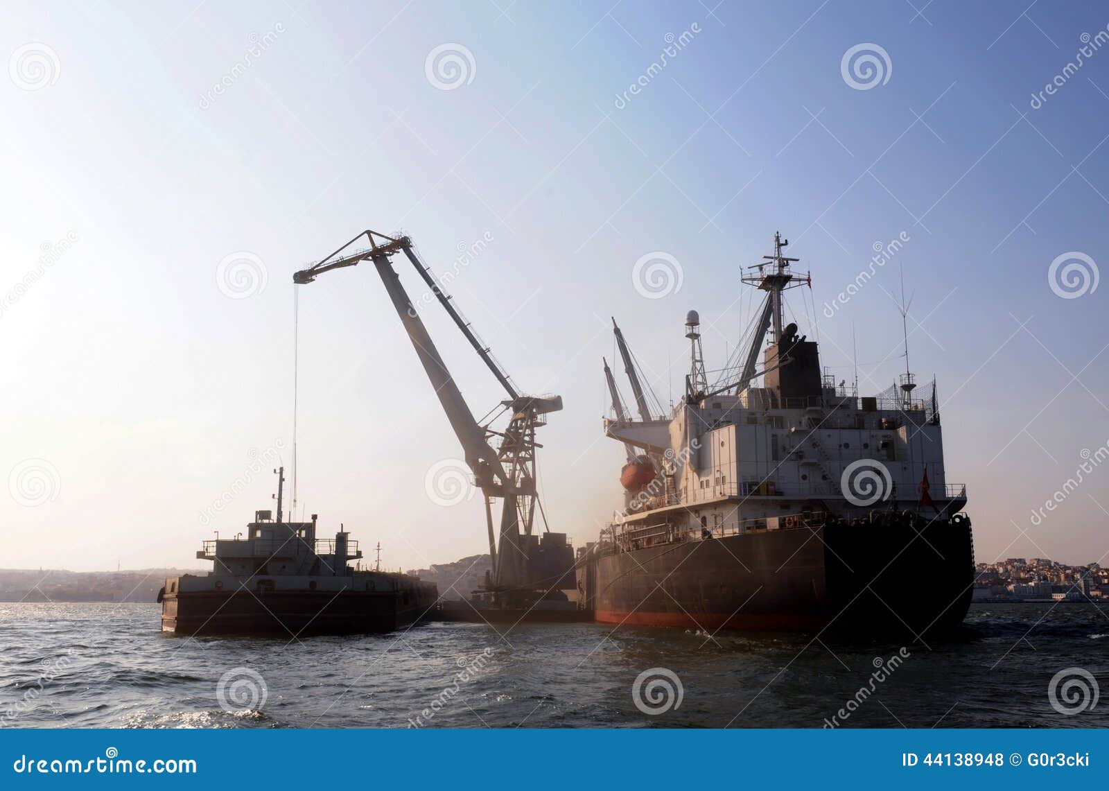 Crane and Cargo Ship, Worldwide Economy Moving Forward Stock Photo