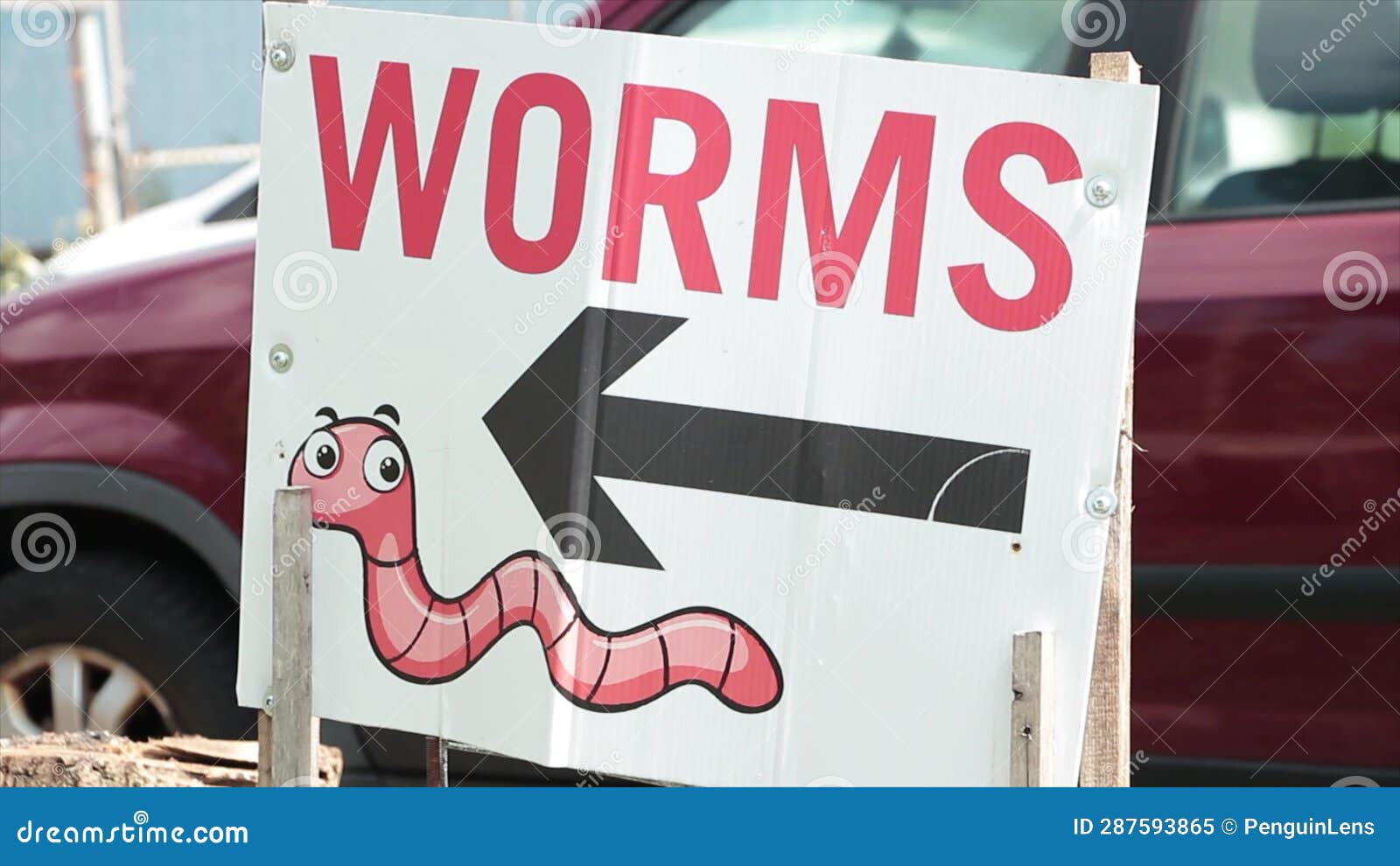 Worms Word Caption Text Writing Sign with an Arrow Pointing Left and