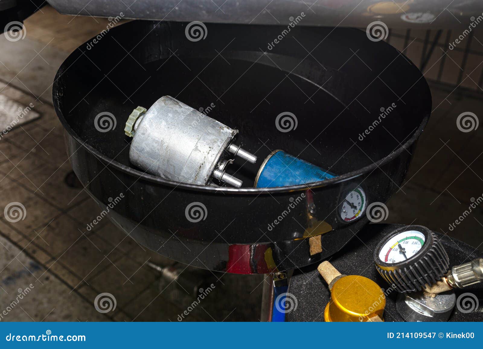 Worn Diesel Fuel Filter, Lying in the Used Car Fluid Container. Stock