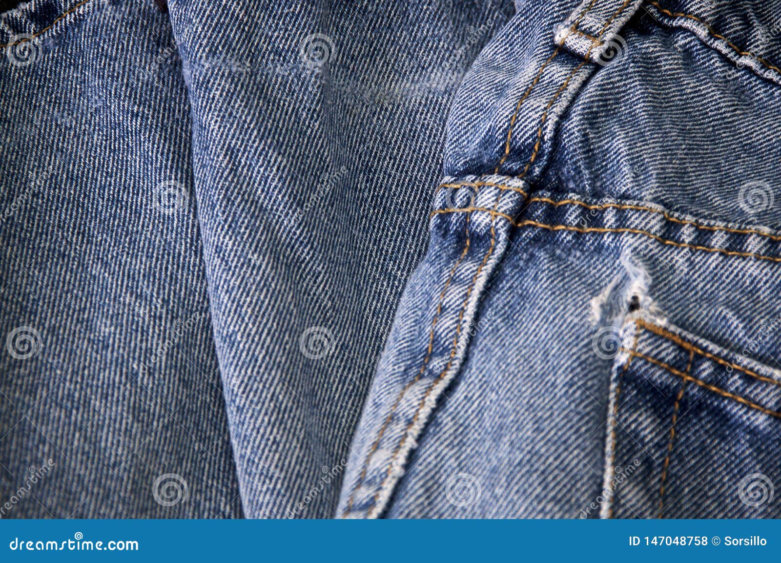 Worn faded jeans with hole stock photo. Image of close - 147048758