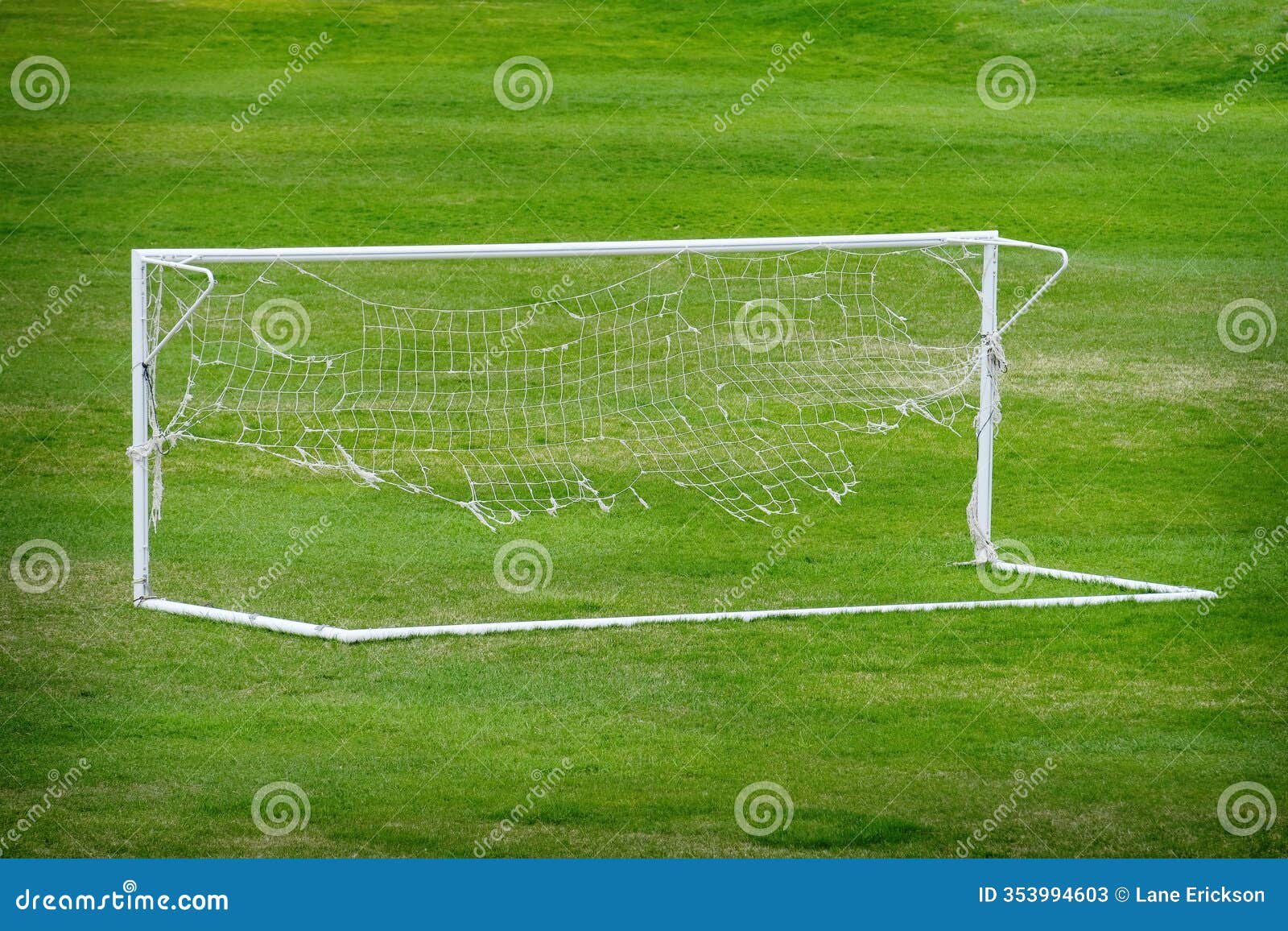 worn out soccer net on goal ratty and frayed netting