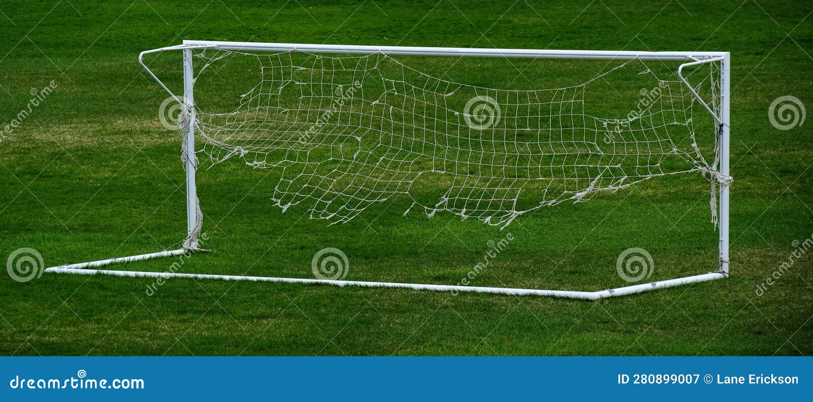 worn out soccer net on goal ratty and frayed netting