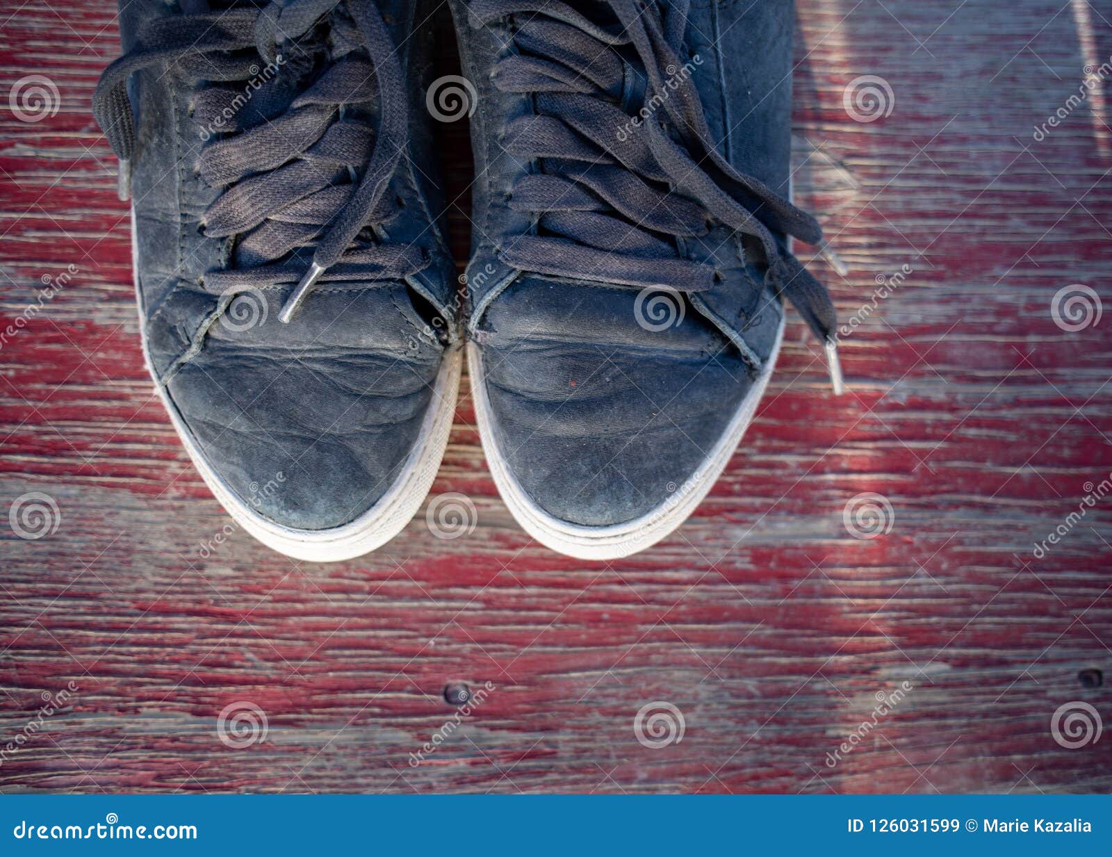 Worn Tennis Shoes and White Socks in Early Morning Sunlight after ...