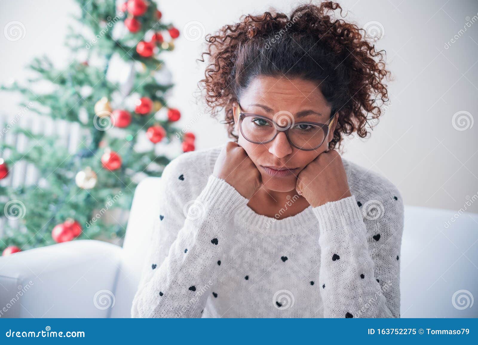 worried black young woman at home on christmas holiday