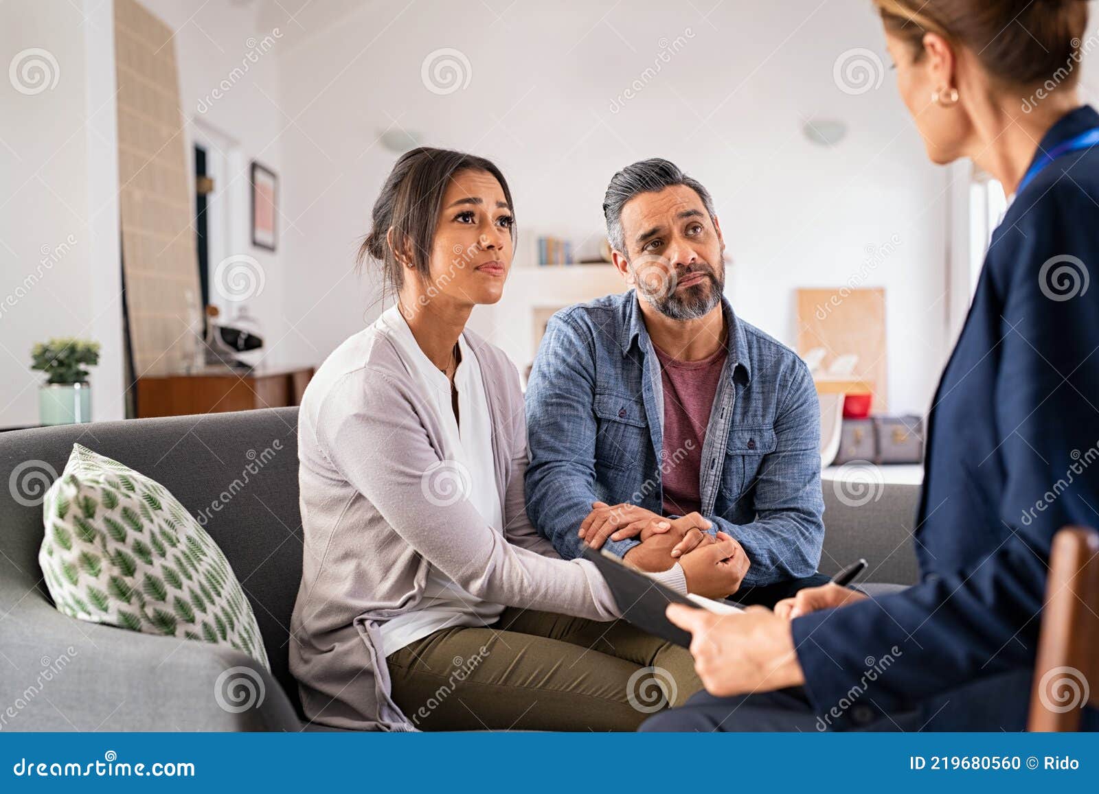 worried couple meeting social counselor