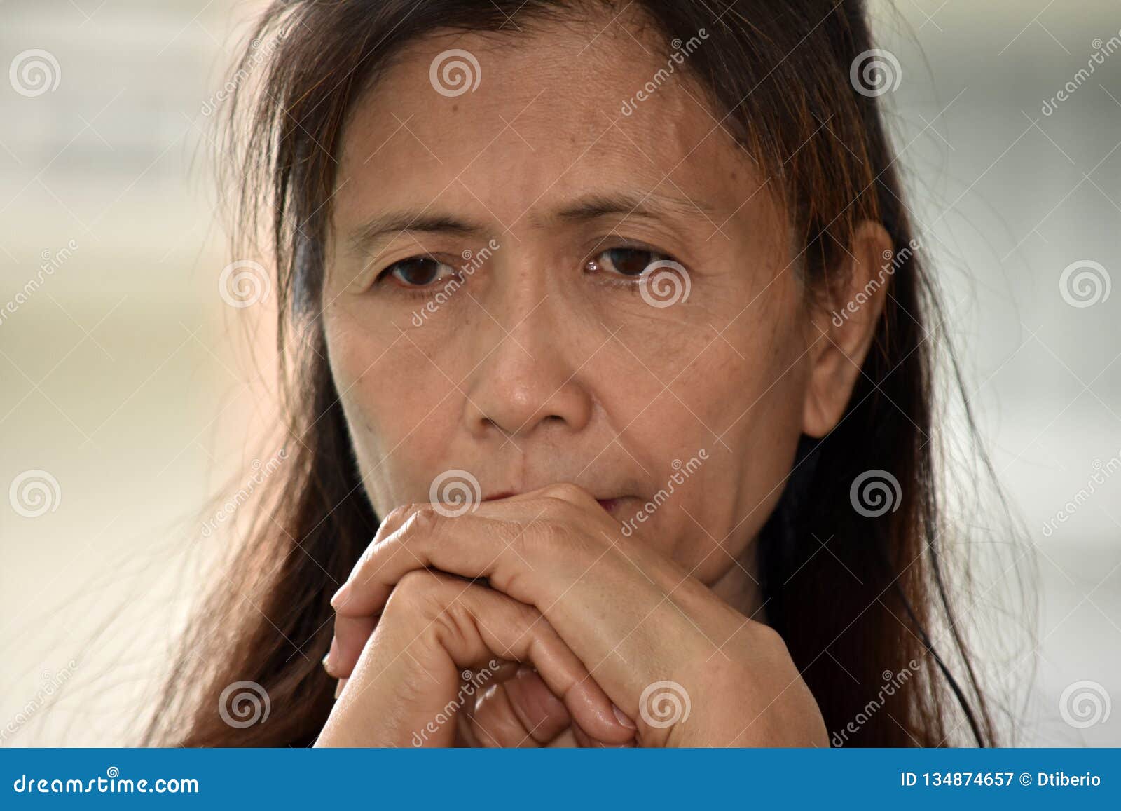 Worried Filipina Female Senior Grandmother Stock Image