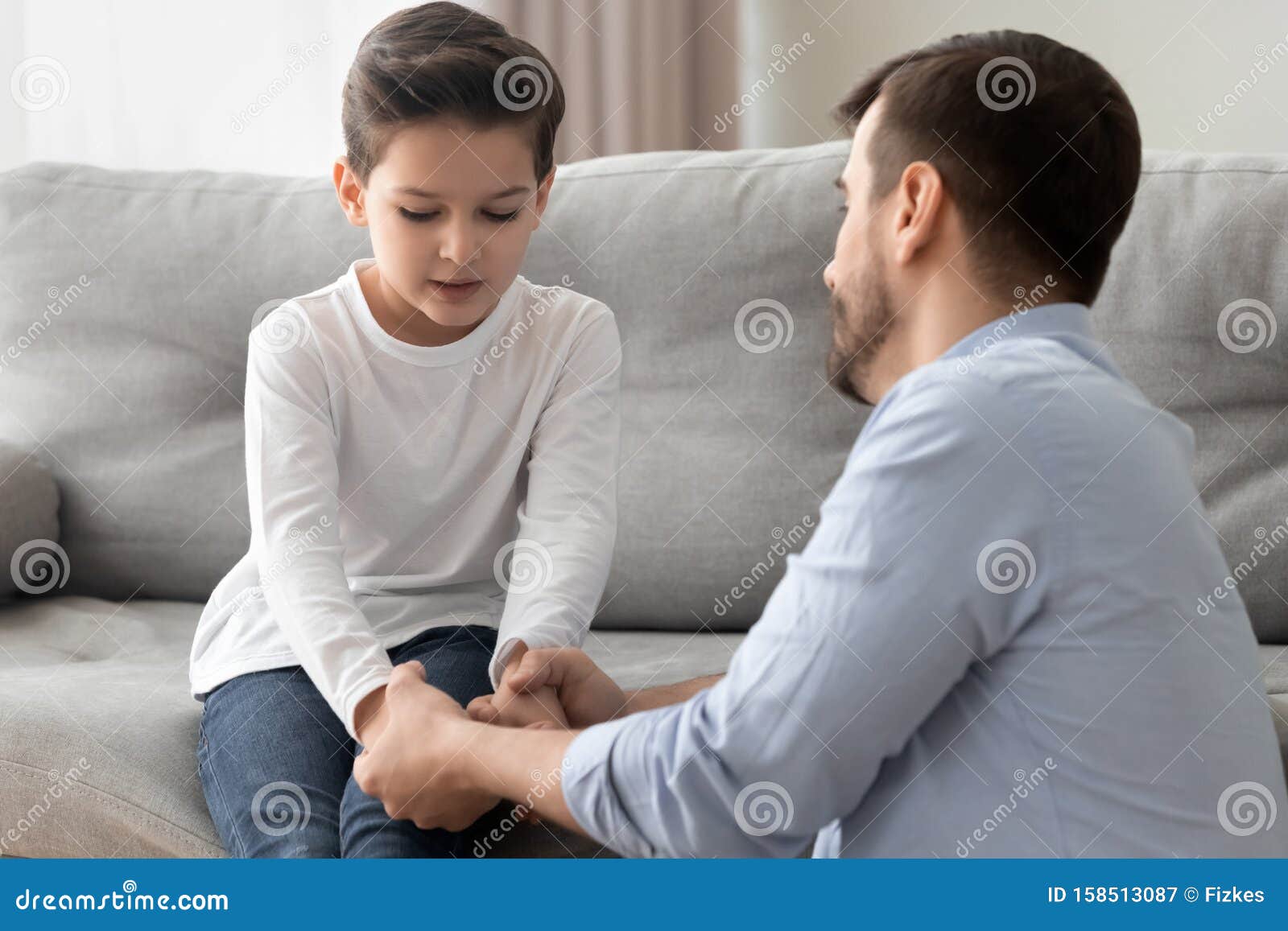 worried single father comforting upset kid son helping with problem