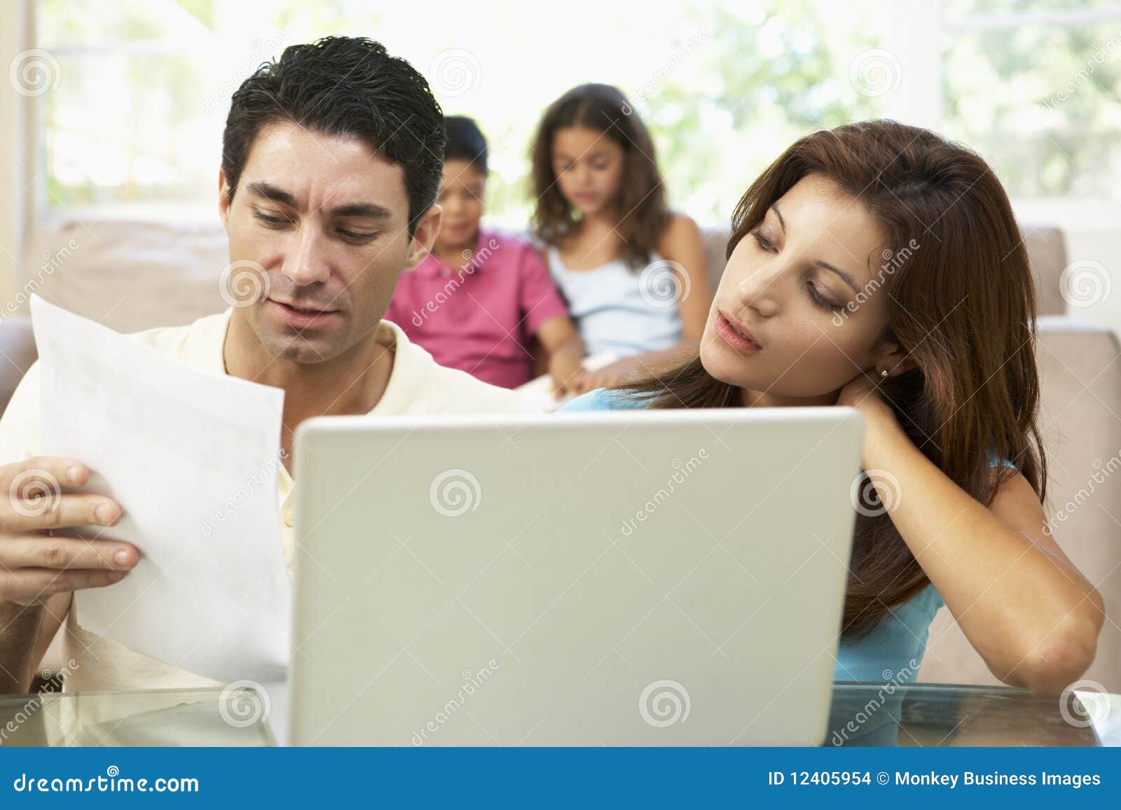 worried parents using laptop at home