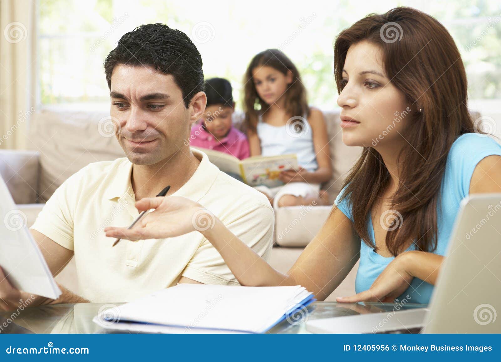 worried parents using laptop at home
