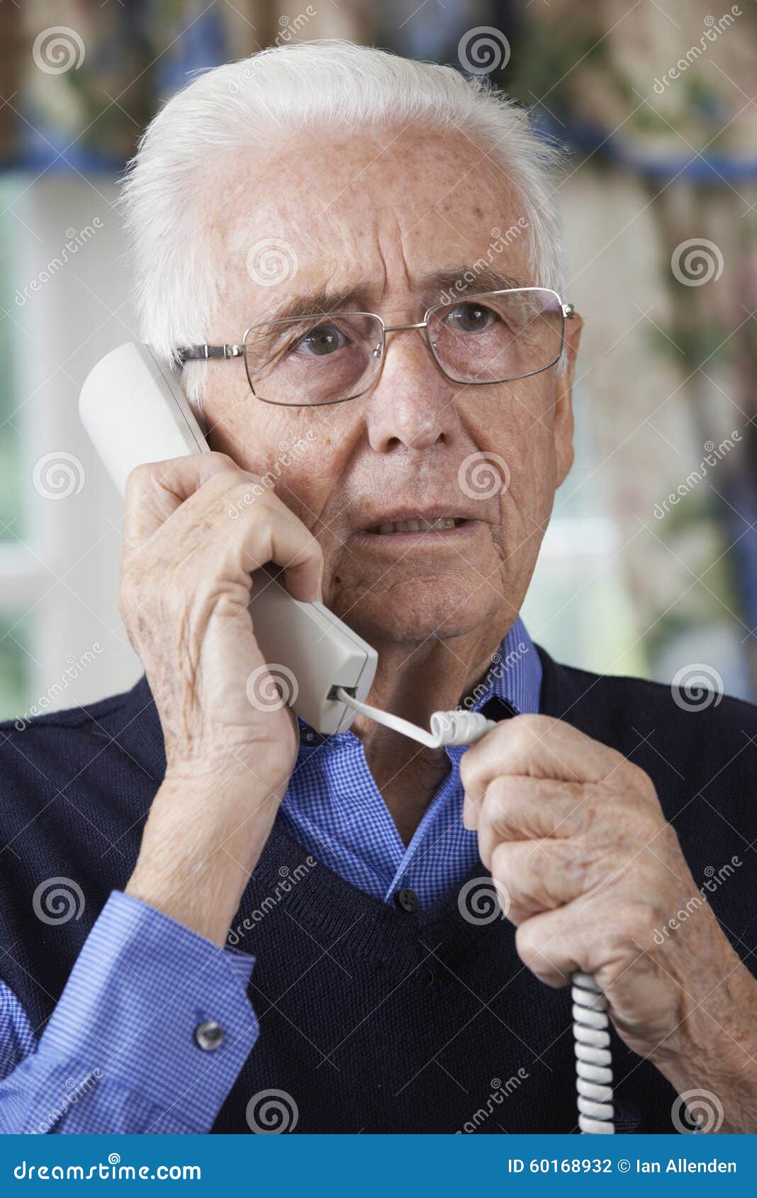 Worried Senior Man Answering Telephone at Home Stock Photo - Image of