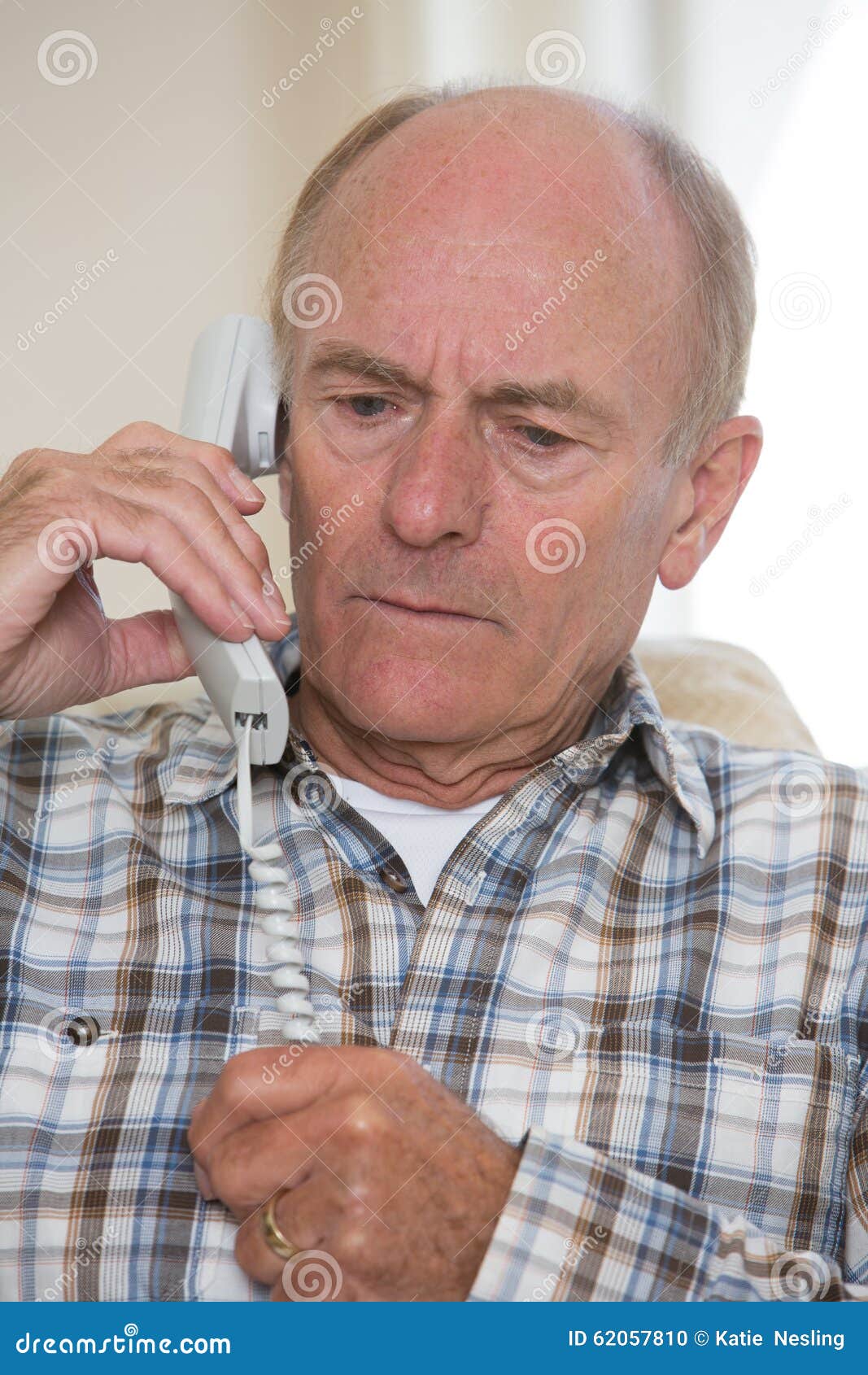 Worried Senior Man Answering Telephone at Home Stock Photo - Image of