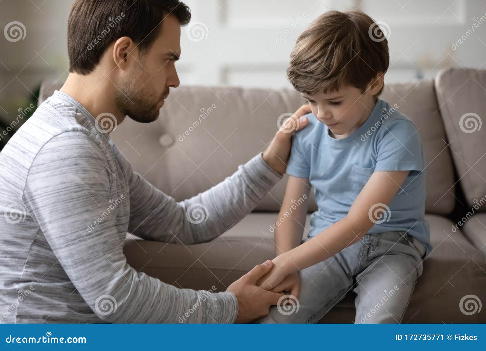 kind daddy supporting depressed offended small boy.