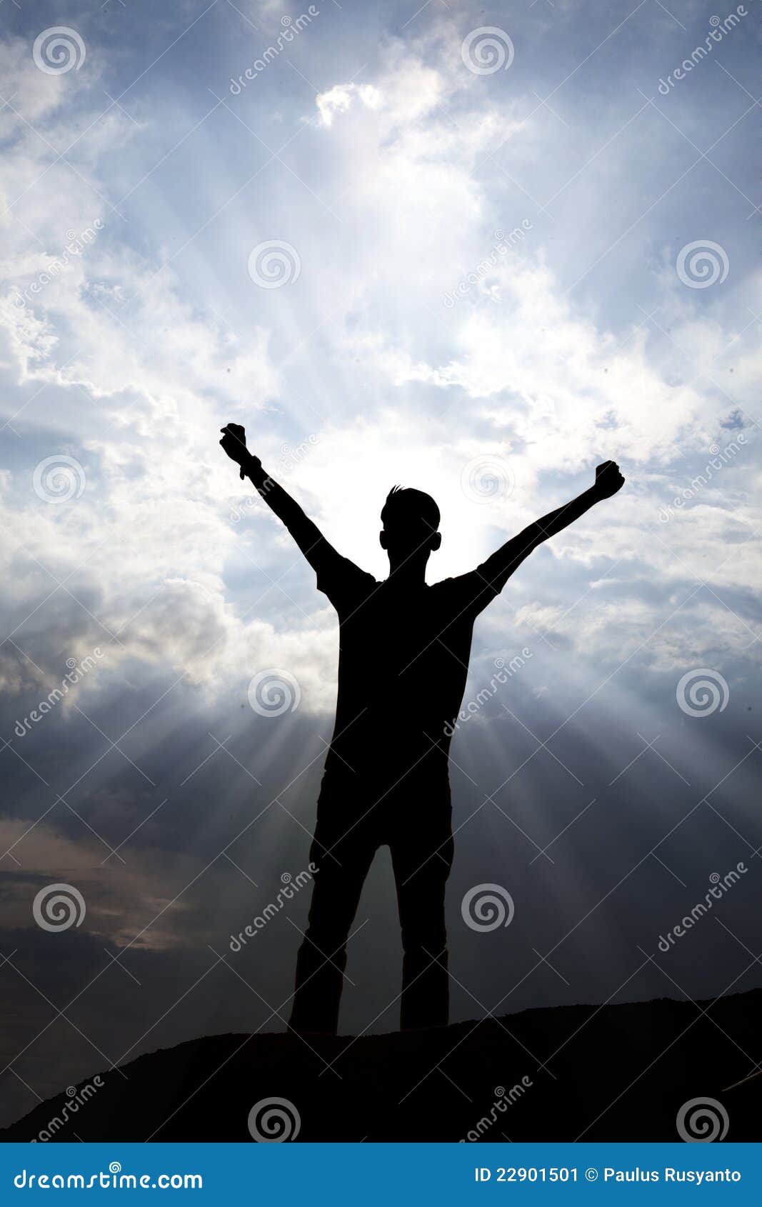 Worship. Silhouette of a man with arms stretched out to the sky