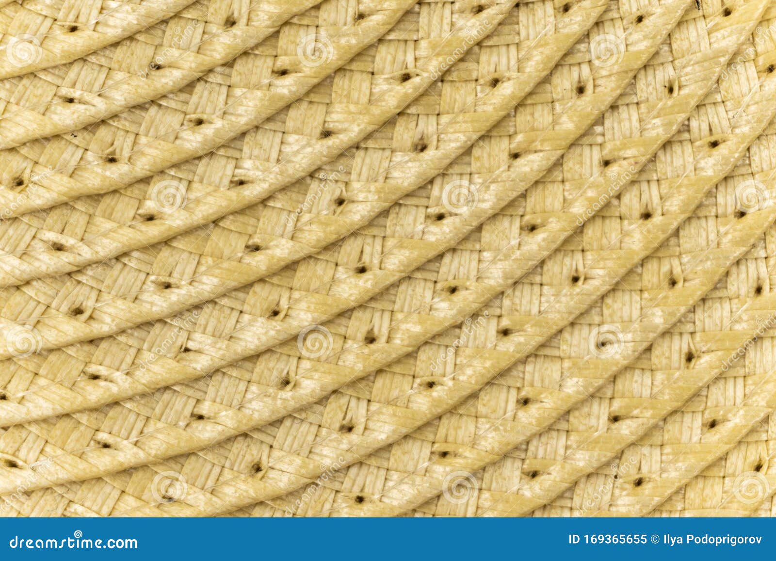 woven yellow wicker straw background or textur