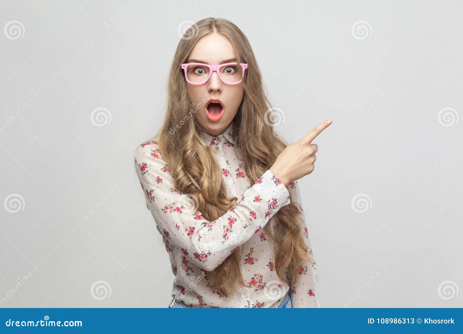 wow! amazing news! beautiful young adult girl, showing finger