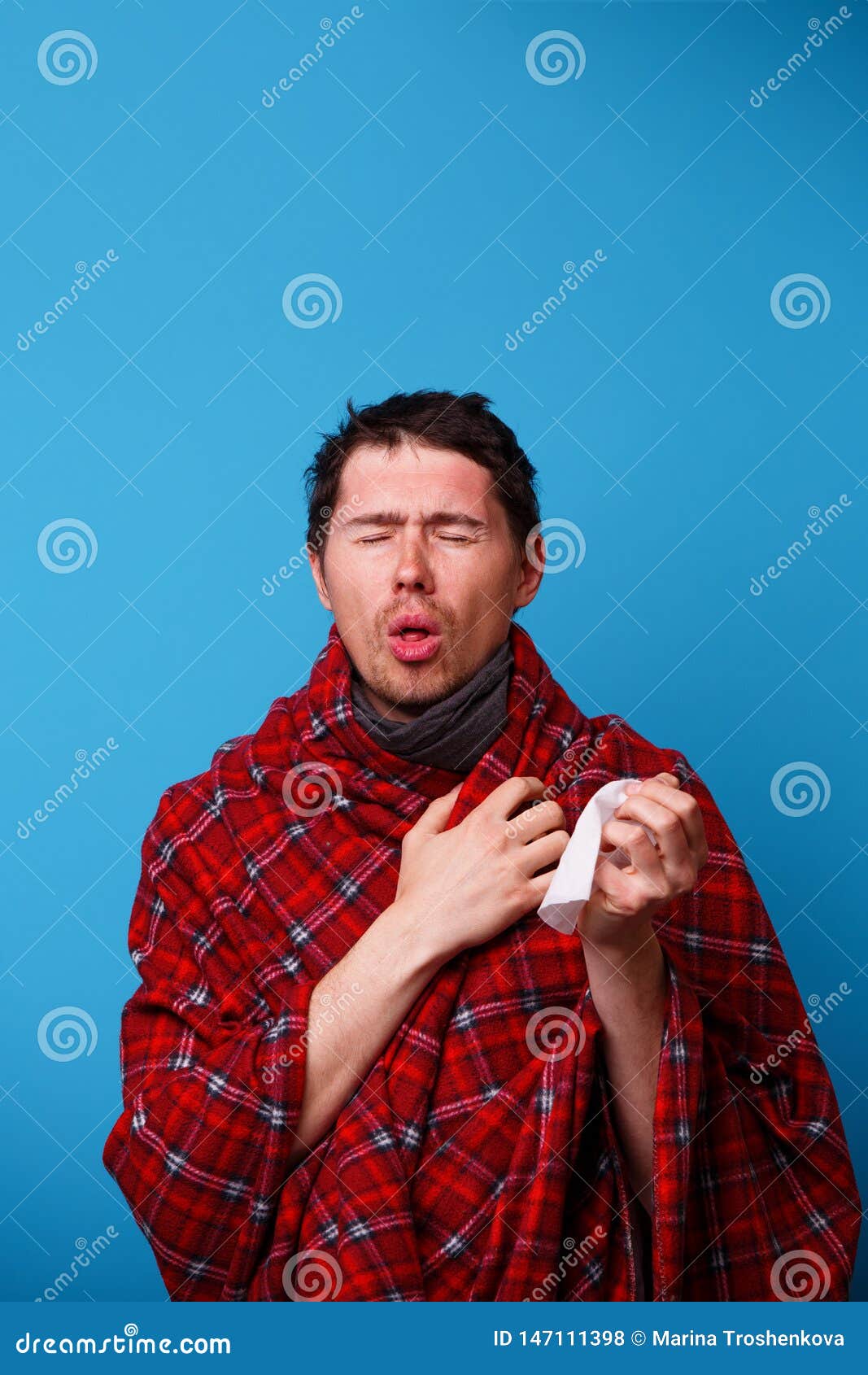 A Wrapped in a Blanket Sick Man is Coughing. Stock Photo Image of