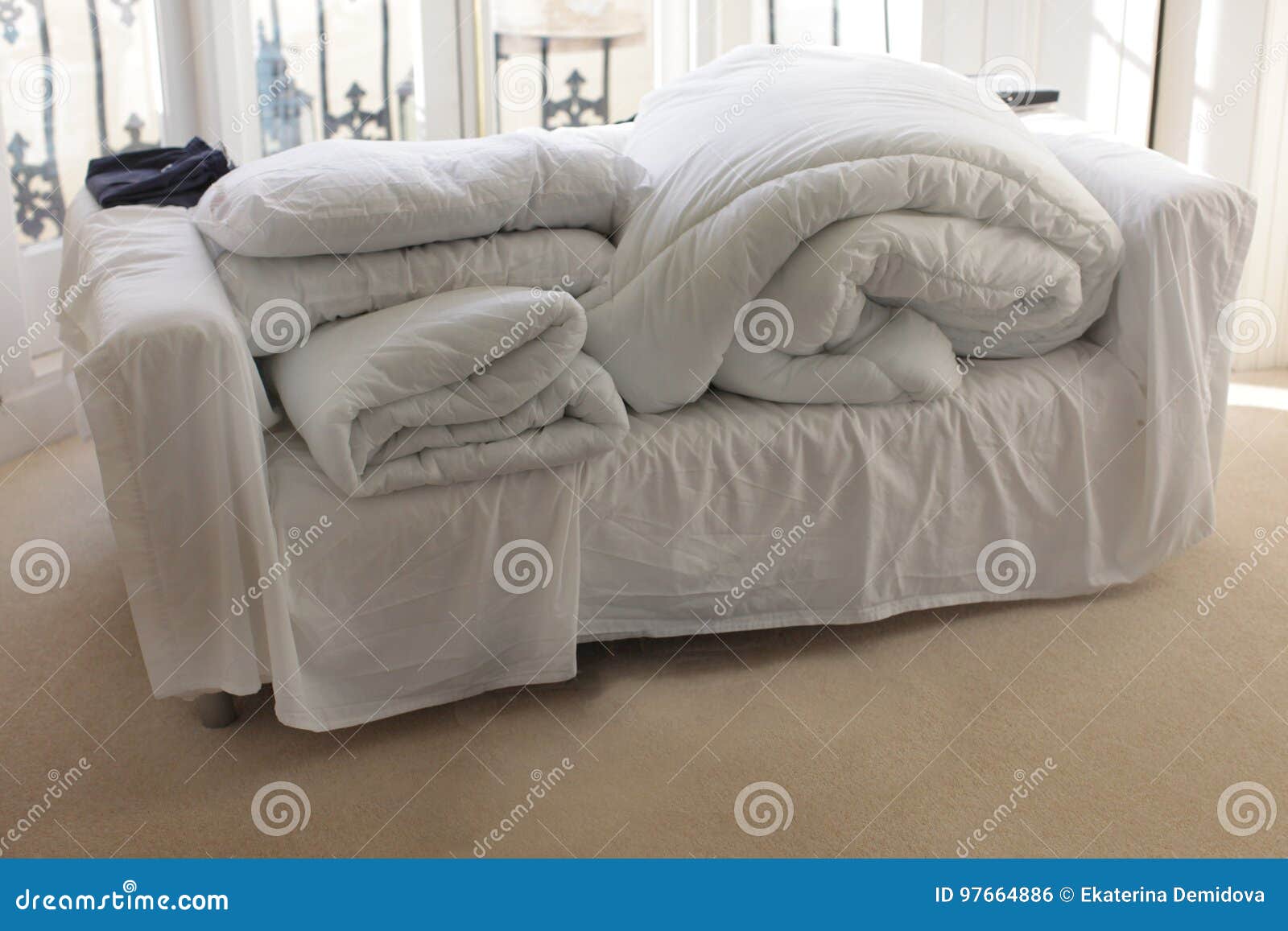 Wrapped blankets on sofa stock photo. Image of abandoned 97664886