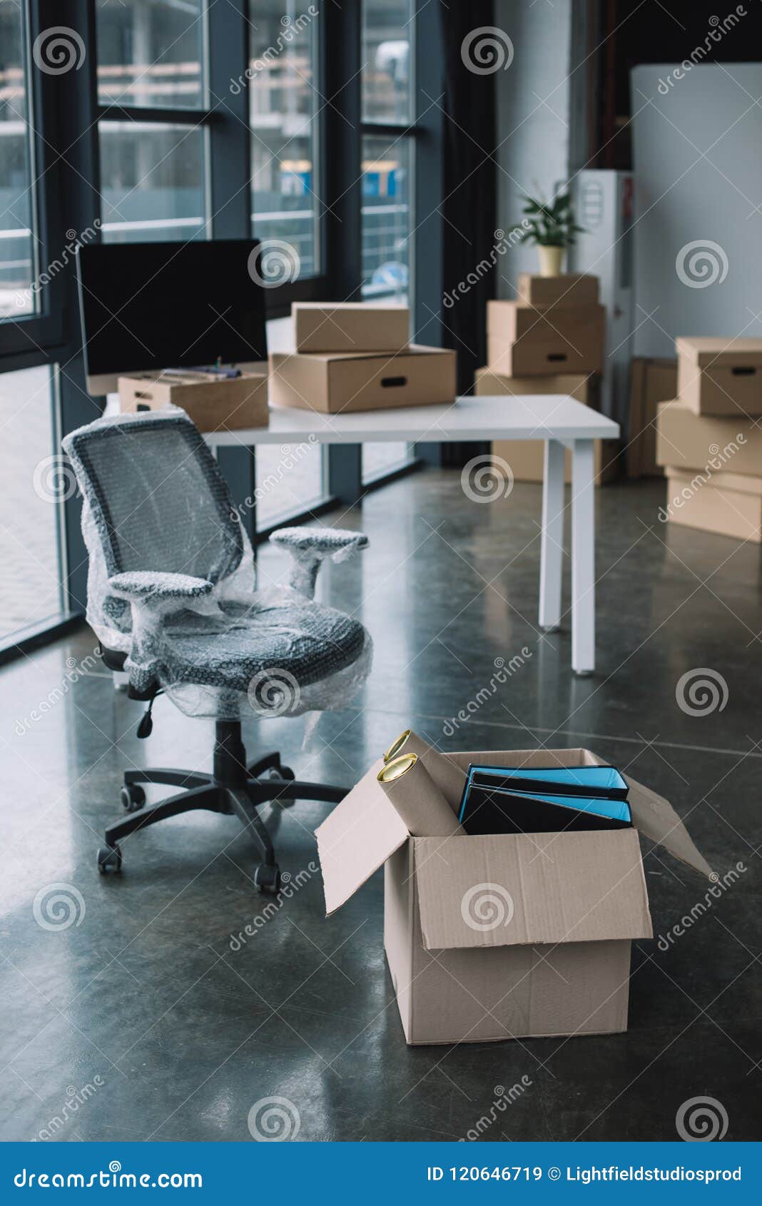 Wrapped Chair and Cardboard Boxes in Office Stock Image Image of