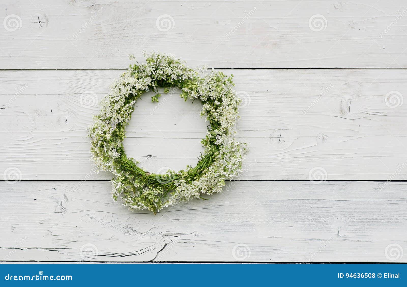 Wreath with White Flowers on a Wooden Background. Rustic Style Stock