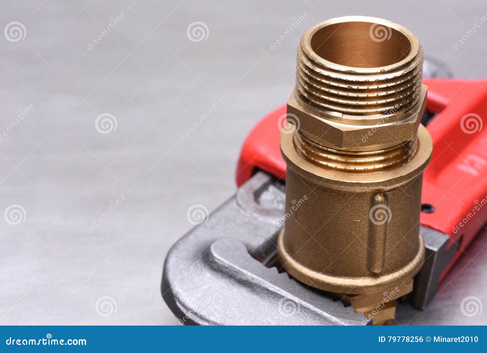 Wrench and brass fittings stock photo. Image of iron 79778256