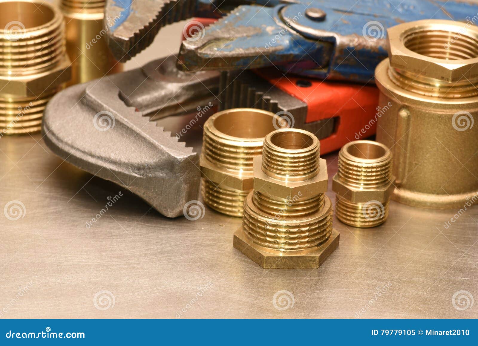 Wrench and brass fittings stock image. Image of iron 79779105
