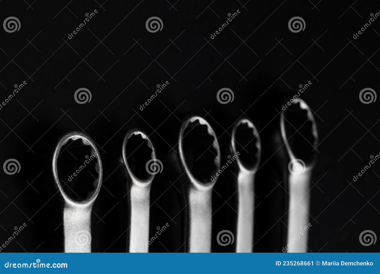 wrenches on black background