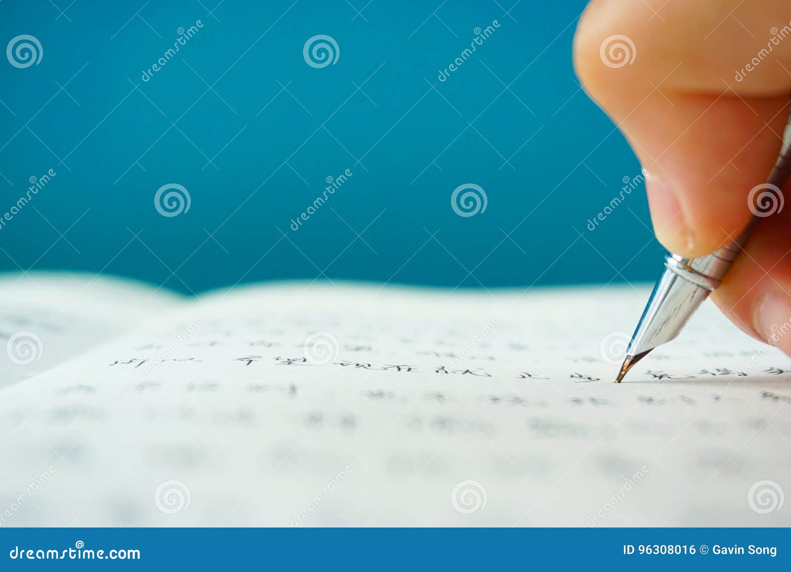 Writing Chinese Characters on Paper with a Fountain Pen Stock