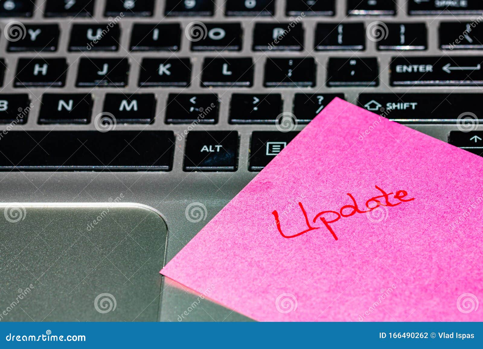 Writing on Colorful Sticky Note Update. Text with Update on Paper