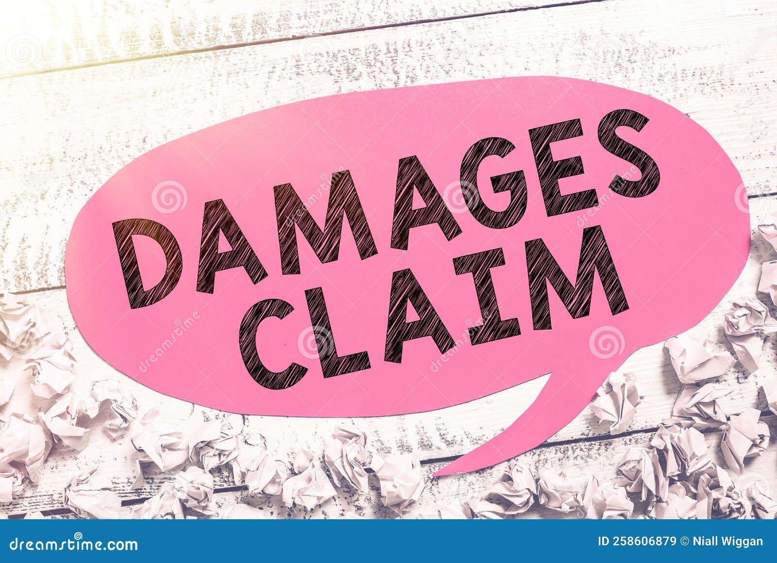 handwriting text damages claim. word written on demand compensation litigate insurance file suit