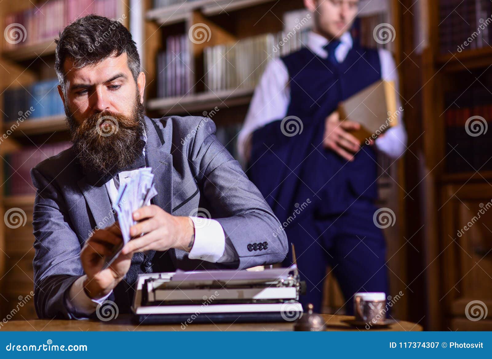 writing and fees concept. man in oldfashioned suit holds money.