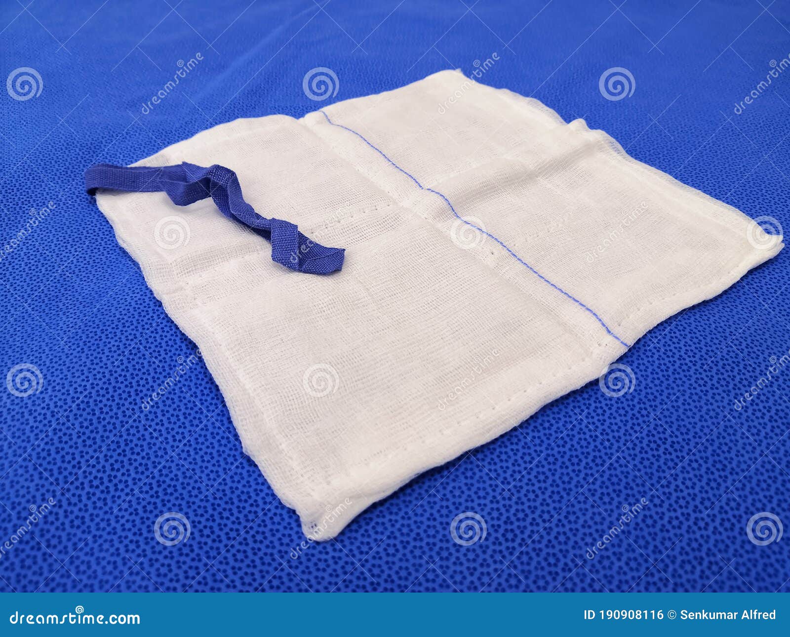 Gauze Swab Soaked In Blood. Attached To The Patient`s Shoulder After Surgery On The Collarbone