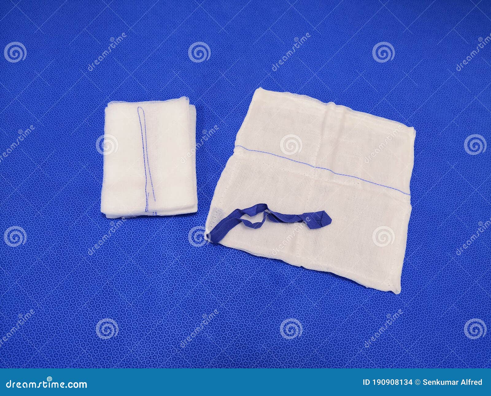 Gauze Swab Soaked In Blood. Attached To The Patient`s Shoulder After Surgery On The Collarbone